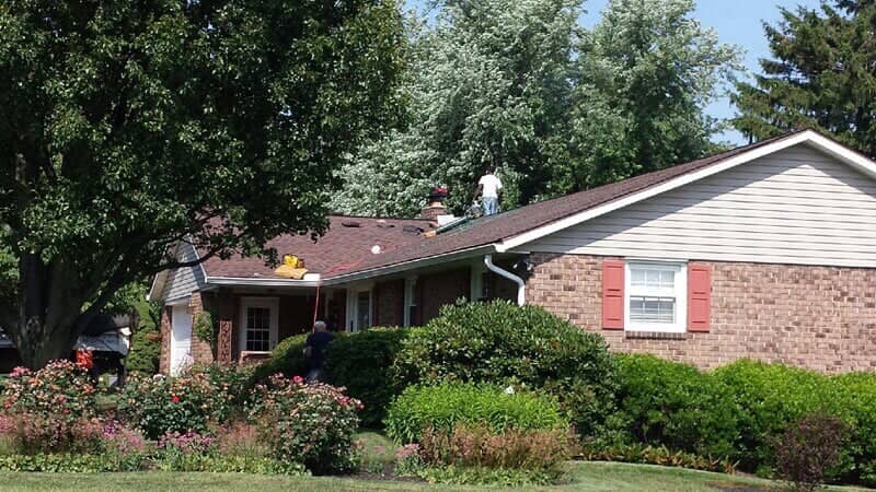 Dallastown crew working on a brick ranch home roof installation